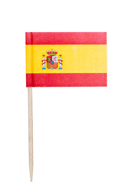 Spanish paper flag Spanish paper toothpick flag. Nice paper texture. Isolated on white.   cocktail stick stock pictures, royalty-free photos & images