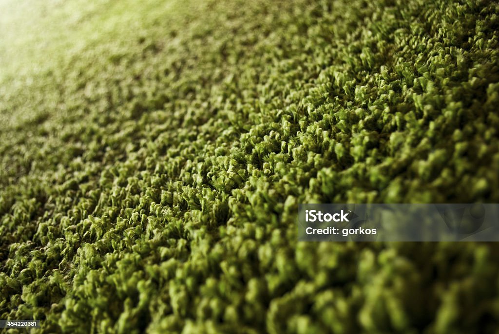 Primo piano della mano green carpet - Foto stock royalty-free di Arredamento