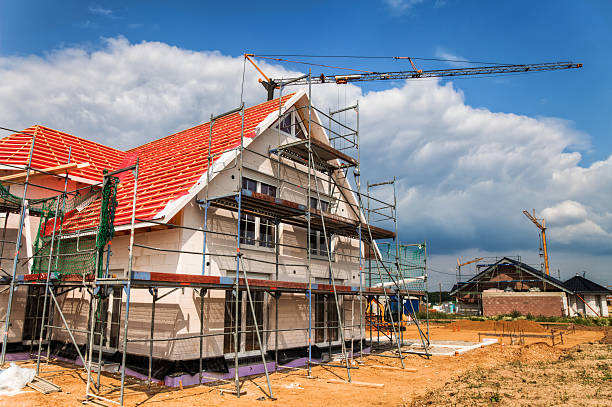 istock Exterior house remodeling with a red roof 454221365