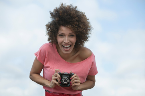 Woman taking picture with a camera