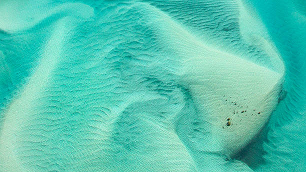 Hill Inlet abstract aerial on Whitehaven Beach Abstract photograph of white sand and turquoise water of picturesque Hill Inlet and Whitehaven Beach, Whitsundays. queensland photos stock pictures, royalty-free photos & images