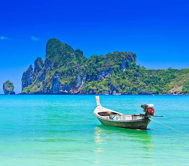 istock Long-tailed boat on sea 454244915