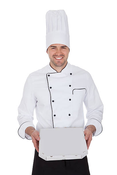 istock Portrait of happy chef holding pizza box 454254913