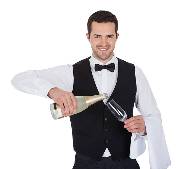 ポートレートのバトラー、シャンパングラスに注ぐ - butler champagne service waiter ストックフォトと画像