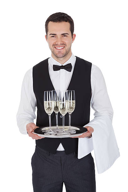 retrato de un joven alegre de mayordomo - waiter butler champagne tray fotografías e imágenes de stock