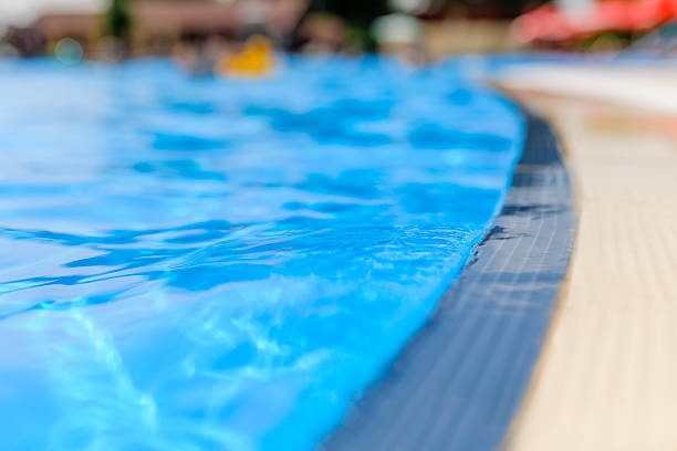 istock edge of swimming pool 454259969