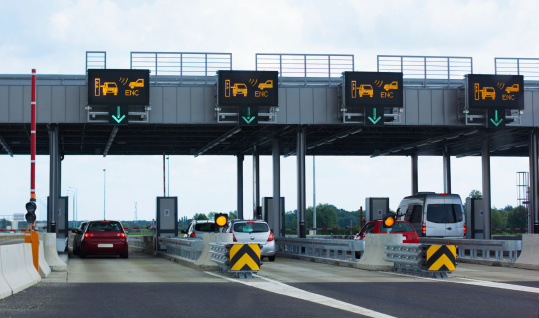 Photo taken from vehicle approaching a toll booth station