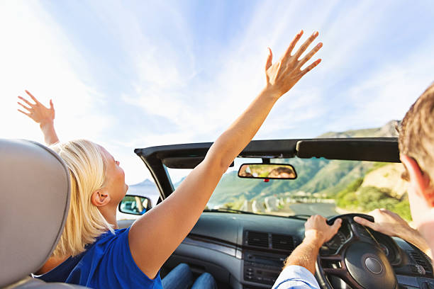 istock Happy Woman Enjoying Road Trip While Driving Car 454274127