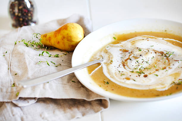 Rutabaga sweet potato soup with pears, cream and maple syrup stock photo