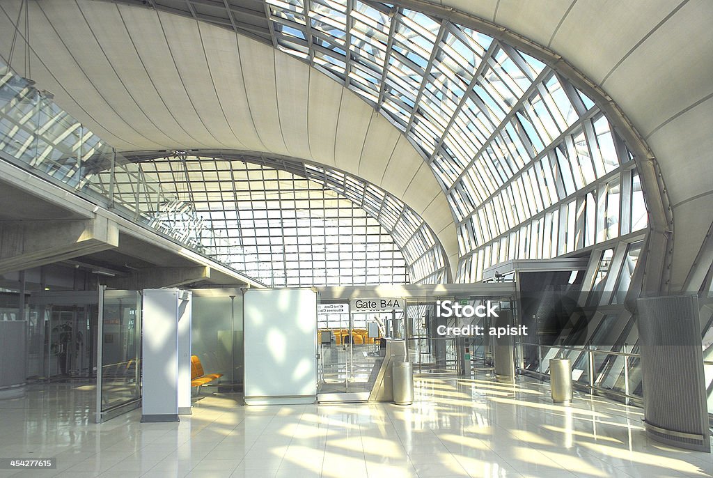 Terminal of Suvarnabhumi airport in Bangkok Passengers waiting to leave at Suvarnabhumi Airport In Bangkok, Thailand Airplane Stock Photo