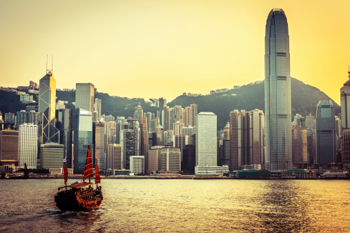 traditional wooden sailboat sailing in victoria harbor,Hong Kong.
