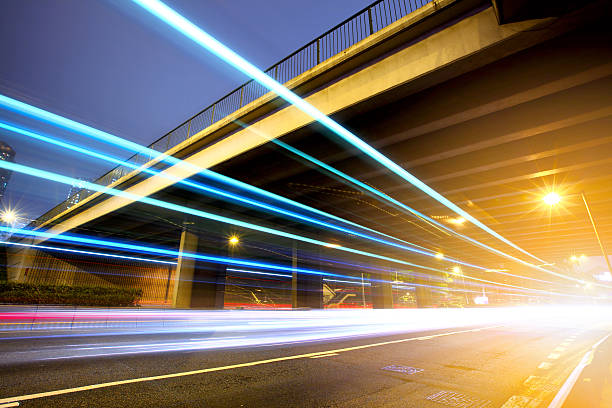 istock Futuristic urban city night traffic 454279543