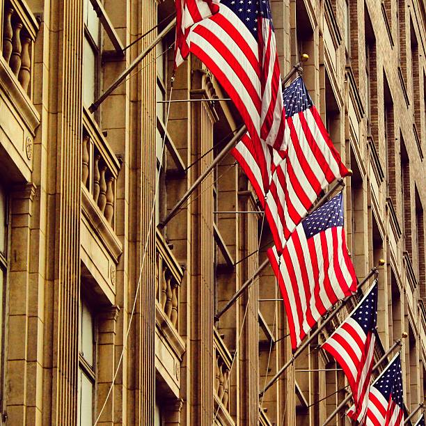 istock Row of American Flags on Brownstone Building. 454288365