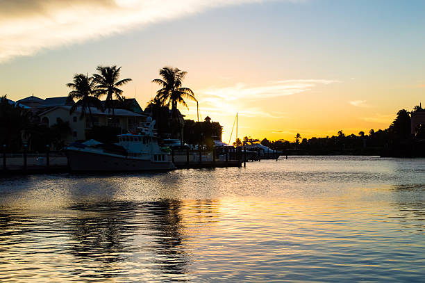 Sunset over the water at a tropical marina stock photo