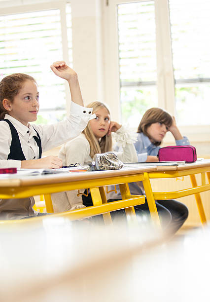 istock Kids at the classroom listening 454293211