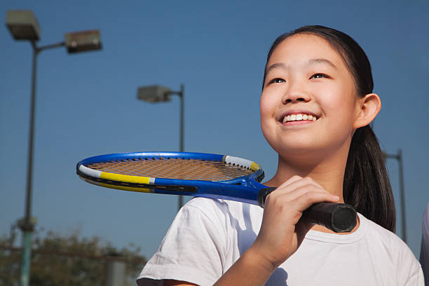 istock Young girl playing tennis 454294861