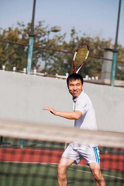 istock Adult men playing tennis 454294993
