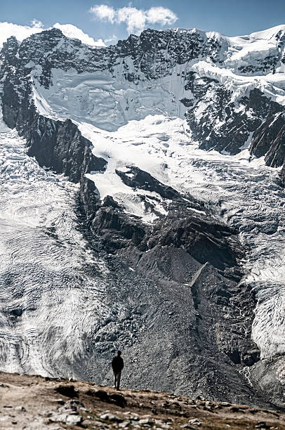 istock Hiker looking toward North Face of Breithorn 4164m 454299111