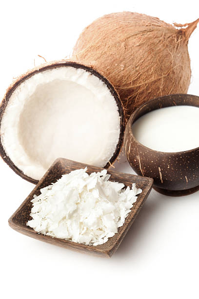 istock Cut Coconut, Milk and Flakes on White Background Vertical 454307895