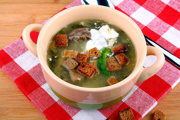 istock Green soup with egg, meat, cream and croutons 454308173