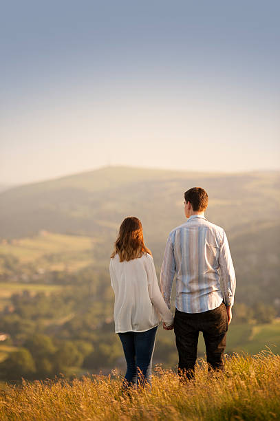 istock young couple in beautiful landscape 454312903