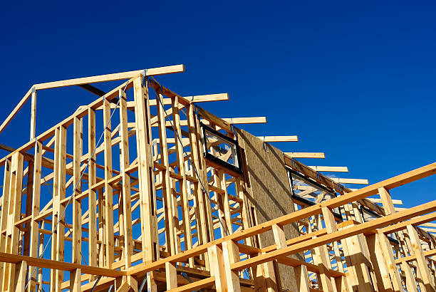 istock Abstract of New Home Construction Site Framing 454315195