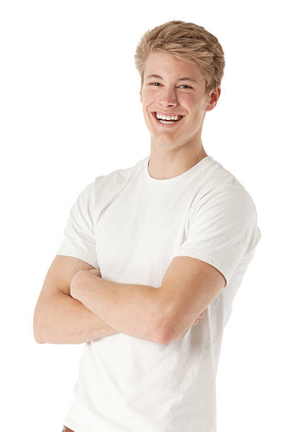istock Young smiling man standing with arms crossed 454316645
