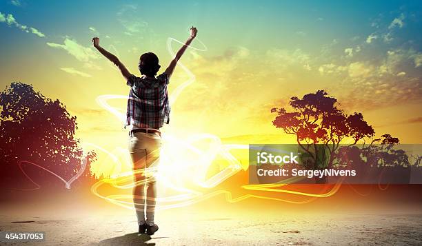 Girl Meets Backlit Dawn Stock Photo - Download Image Now - Activity, Adult, Horizontal