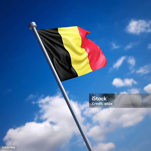 Flag Of Belgium Against Blue Sky Stock Photo - Download Image Now - Belgian Culture, Belgian Flag, Belgium