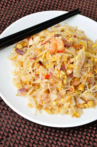stir fried chinese flat rice flour noodles with shrimp and vegetablesstir fried chinese flat rice flour noodles with shrimp and vegetables