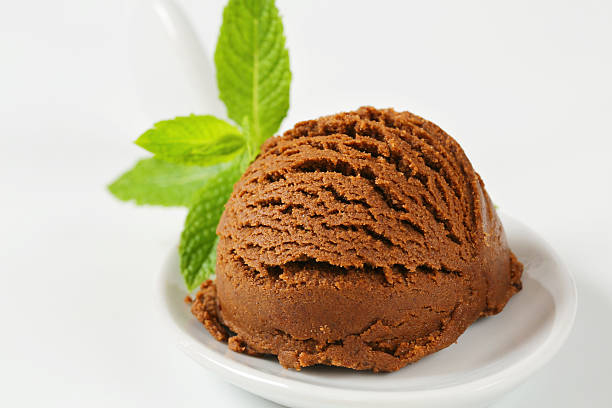istock Scoop of chocolate ice cream in a plastic spoon 454321141
