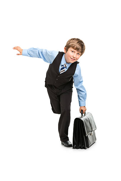 istock 9 years old boy looking like businessman 454321227