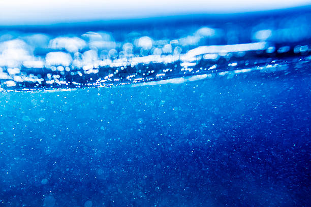 istock Underwater shot of splashing air bubbles 454321609