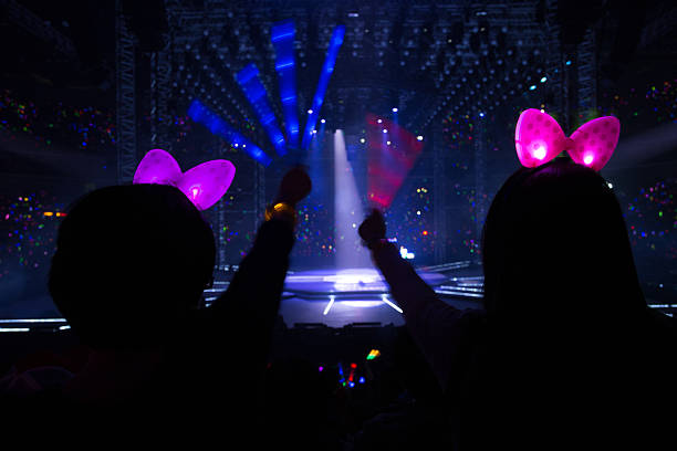 istock Silhouettes of dancing people having a celebration 454323721
