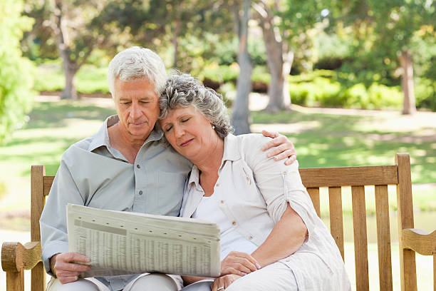 istock Woman resting while her husband is reading a newspaper 454324559