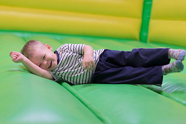 istock Smiling baby on colorful slide 454324647