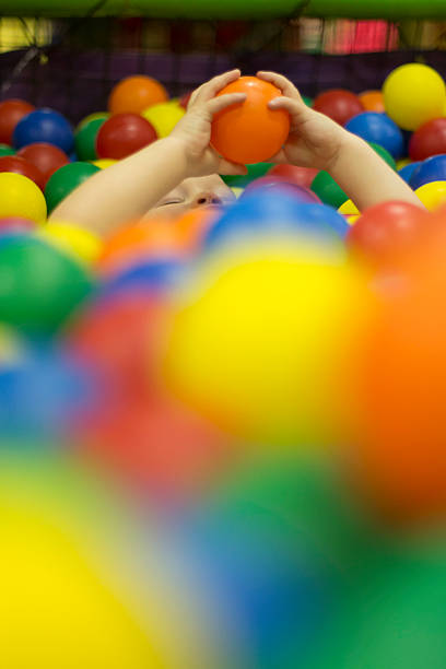 istock Smiling baby on colorful slide 454325271