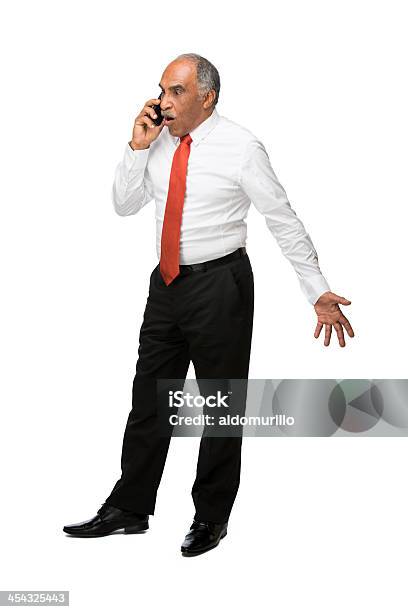 Foto de Impressionado Homem De Negócios Latino No Telefone e mais fotos de stock de No telefone - No telefone, Homens, Frustração