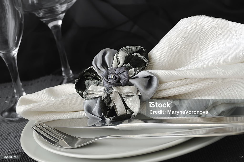 folded napkin with a clamp in the shape of  flower Cafe Stock Photo