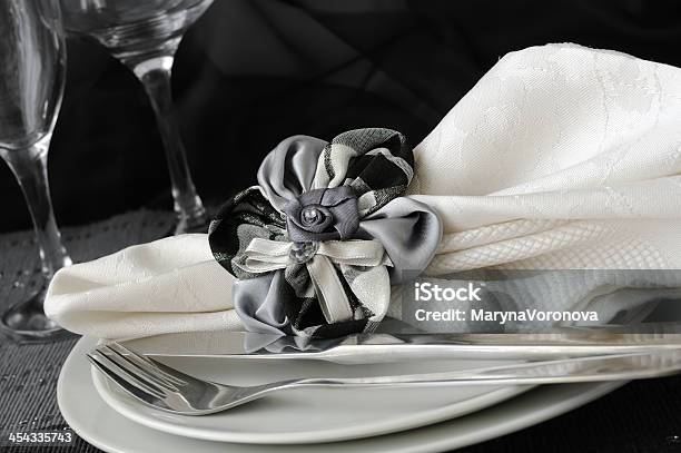 Folded Napkin With A Clamp In The Shape Of Flower Stock Photo - Download Image Now - Cafe, Celebration, Cooking Utensil