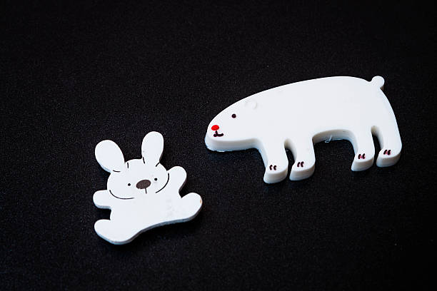 istock Close up white animal magnets on dark background 454336623