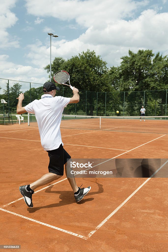 Развлекательные игры в теннис - Стоковые фото Два человека роялти-фри