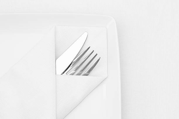 istock Place setting, plate with cutlery and white napkin 454337905