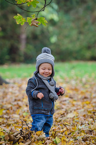 istock Smiling baby walking in a park 454339723