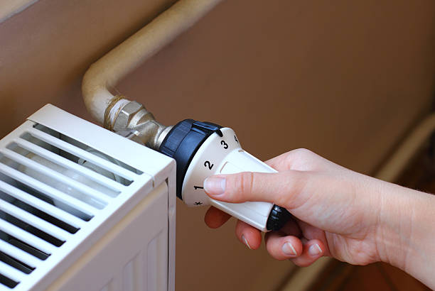 istock Turning on the radiator to save energy 454339813