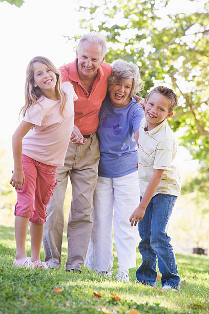 istock Grandparents laughing with grandchildren 454339861