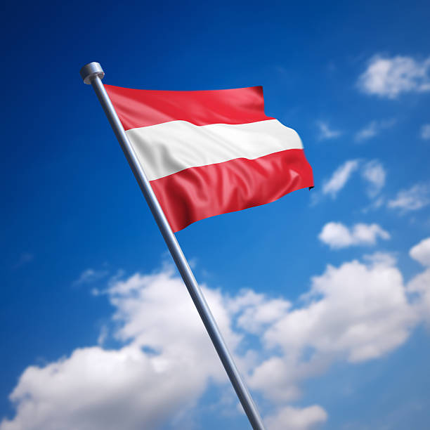 istock Flag of Austria against blue sky 454341635