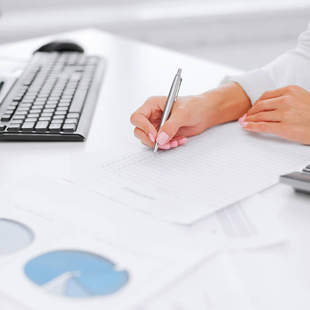 istock businesswoman working with calculator in office 454343825