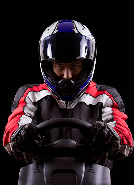 costas em borboleta com um capacete e vermelho equipamento de protecção - racing helmet imagens e fotografias de stock