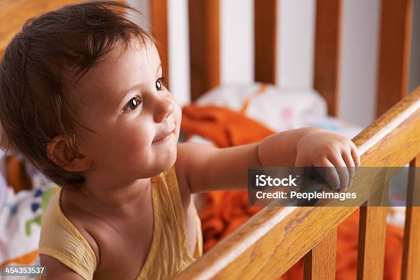 She Wants Out Of The Crib Stock Photo - Download Image Now - 12-17 Months, 12-23 Months, Adult